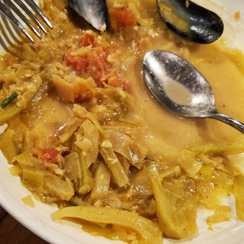 Nomad Eatery - Onions and tomato chunks I'm shellfish soup - Mediterranean Near Me - El Segundo, California