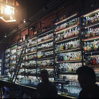 Paper Plane - Their wall of spirits behind the bar - Cocktail Bars Near Me - San Jose, California Paper Plane - Their wall of spirits behind the bar - Cocktail Bars Near Me - San Jose, California