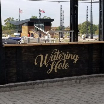 The Wharf DC - Watering Hole looks to be a pop-up spot that you get drinks - this spot has curtains and some ceiling fans too. - Landmarks & Historical Buildings Near Me - Washington, DC, District of Columbia