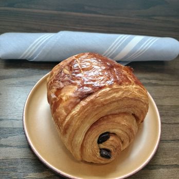 Ladybird Deli and Bakery - Pain au chocolat with a place setting in cloth napkin. - Delis Near Me - Hamburg, New York Ladybird Deli and Bakery - Pain au chocolat with a place setting in cloth napkin. - Delis Near Me - Hamburg, New York