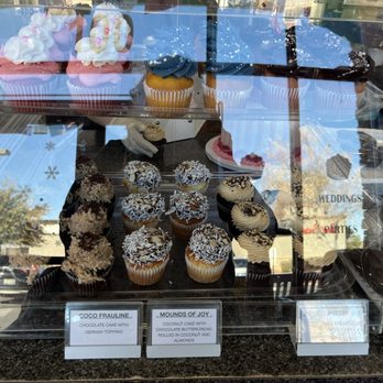 The Cupcakery - Another selection of cupcakes for the day (sorry for the window glare). - Cupcakes Near Me - Las Vegas, Nevada The Cupcakery - Another selection of cupcakes for the day (sorry for the window glare). - Cupcakes Near Me - Las Vegas, Nevada