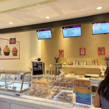 Delicious Sweets Bakeshop - a woman standing in front of the counter - Cupcakes Near Me - Auburn Hills, Michigan Delicious Sweets Bakeshop - a woman standing in front of the counter - Cupcakes Near Me - Auburn Hills, Michigan
