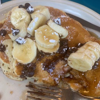 Olympic Flame Restaurant - Pancakes with banana and chocolate chips...did say they were mixed in, but clearly not. - Breakfast & Brunch Near Me - Myrtle Beach, South Carolina Olympic Flame Restaurant - Pancakes with banana and chocolate chips...did say they were mixed in, but clearly not. - Breakfast & Brunch Near Me - Myrtle Beach, South Carolina