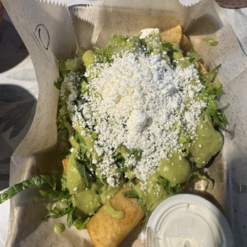 Tacos 805 - Taquitos with shredded chicken - All four of them were buried in condiments. Had to pull one out for the photo - Mexican Near Me - Simi Valley, California
