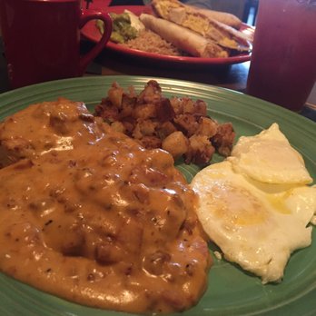 San Pedro Cafe - Front dish is biscuits and gravy, back plate is breakfast quesadilla. Both were delicious, and each of us argued that we "won" - Seafood Near Me - Hudson, Wisconsin