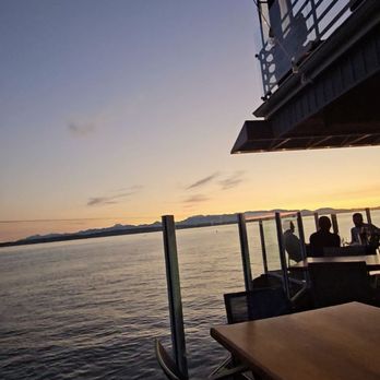 Ray's Boathouse - Sunset view from the waterfront patio - New American Near Me - Seattle, Washington Ray's Boathouse - Sunset view from the waterfront patio - New American Near Me - Seattle, Washington
