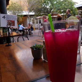 Seis Kitchen - House made Prickly pear-Limon Agua Fresca over the patio at sunset - Mexican Near Me - Tucson, Arizona Seis Kitchen - House made Prickly pear-Limon Agua Fresca over the patio at sunset - Mexican Near Me - Tucson, Arizona