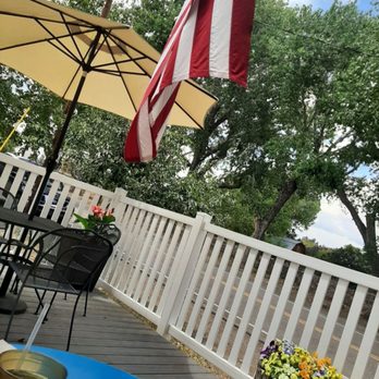 Hillsboro General Store Cafe - patio with table and umbrella - Cafes Near Me - Hillsboro, New Mexico