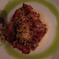 Horseradish crusted cod over garlic mashed potatoes and chive oil
