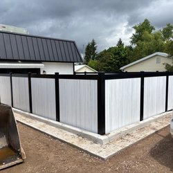 JLH Fence & Farm Service - Digger Specialties Designer black aluminum frame with vinyl infill in cottage gray fence - This Petoskey restaurant is absolutely thrilled!