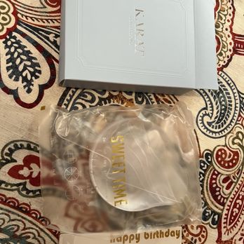 Karat Confections - Plates and candle included with cake - Bakeries Near Me - New York, New York