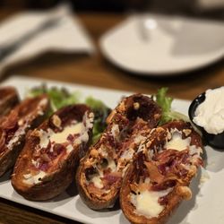 Navarro’s Bar & Grill - Loaded potato skins with sour cream.