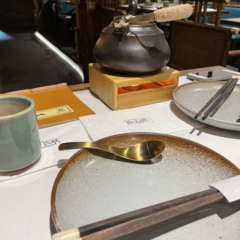 Cheli - Flushing - Longjing teapot for the table (warmed with a small candle underneath). - Shanghainese Near Me - Flushing, New York