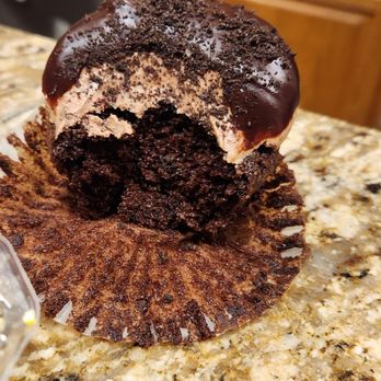 Wanna Cupcake? Bakery Cafe - a half eaten chocolate cupcake - Bakeries Near Me - University Place, Washington Wanna Cupcake? Bakery Cafe - a half eaten chocolate cupcake - Bakeries Near Me - University Place, Washington