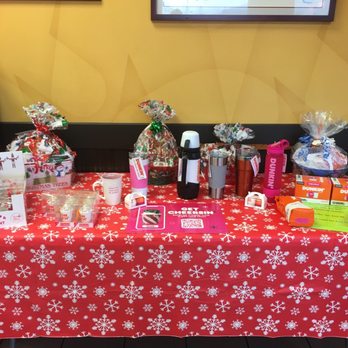Dunkin' - a table with a red tablecloth covered in candy - Donuts Near Me - Lock Haven, Pennsylvania Dunkin' - a table with a red tablecloth covered in candy - Donuts Near Me - Lock Haven, Pennsylvania