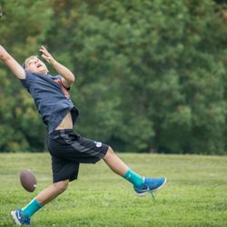 Barefoot Republic Camp & Retreat Center - Boy playing football at camp in Franklin, Tennessee