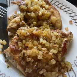 Perfectly executed chicken with grilled onions.