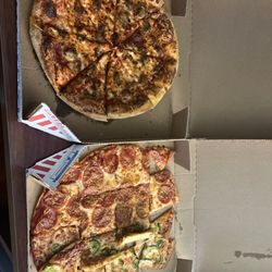 Domino's Pizza - This is how the pizza arrived hey  And it looks like big foot stepped on it and then ran over it  Do better please!