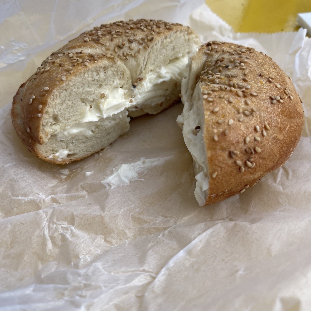 Sesame bagel toasted with plain cream cheese