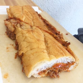 Trigo Café - "The Porky" a tender pork sandwich in sriracha guava sauce. Big enough for 2-3 people. - Cuban Near Me - Hialeah, Florida Trigo Café - "The Porky" a tender pork sandwich in sriracha guava sauce. Big enough for 2-3 people. - Cuban Near Me - Hialeah, Florida