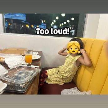 Tempe Eats - Daughter plugging her ears to karaoke. - Barbeque Near Me - Tempe, Arizona
