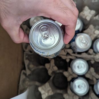 Half Time - a person opening a can of beer - Beer, Wine & Spirits Near Me - Poughkeepsie, New York