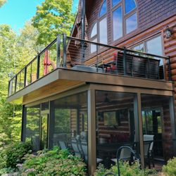 Composite deck with cable railing system with living space underneath Central Lake Michigan