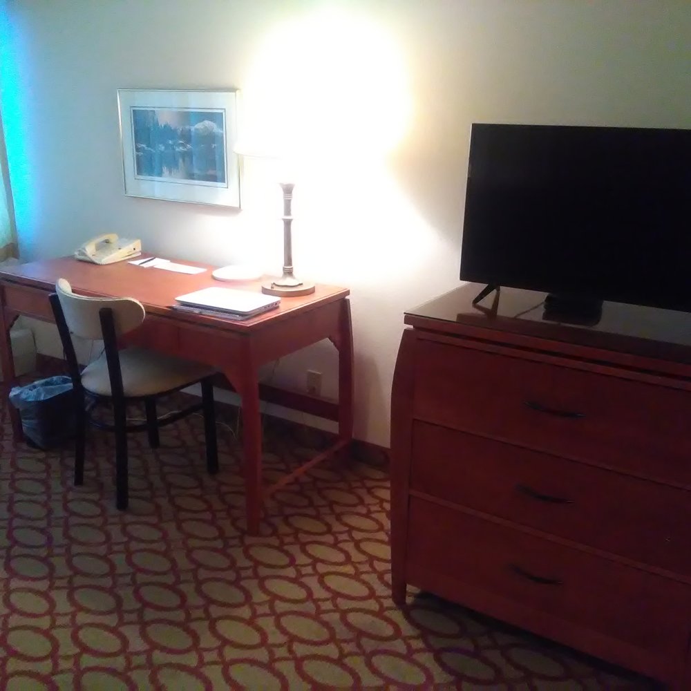 Anchorage Grand Hotel - Desk and television in living room area. - Hotels Near Me - Anchorage, Alaska Anchorage Grand Hotel - Desk and television in living room area. - Hotels Near Me - Anchorage, Alaska