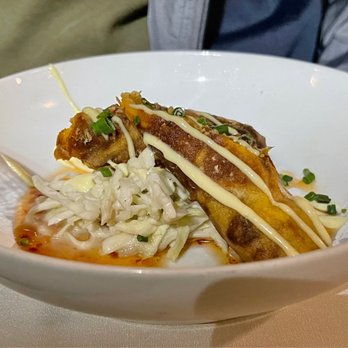 Sage Room - a bowl of food with a fork in it - New American Near Me - Hilton Head Island, South Carolina Sage Room - a bowl of food with a fork in it - New American Near Me - Hilton Head Island, South Carolina