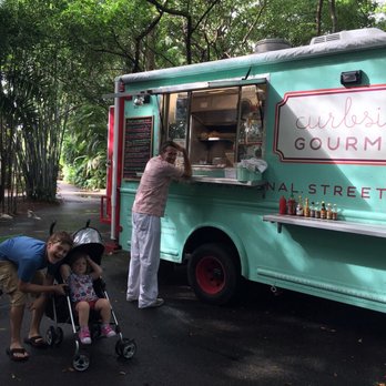 Curbside Gourmet - Truck sets up with matching tables and chairs. Cute!! - Food Trucks Near Me - Stuart, Florida