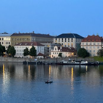 Four Seasons Hotel - View of Four Seasons from Charles Bridge  - it's the one with the red roof and three floors! (May, 2023) - Hotels Near Me - Prague, Puerto Rico