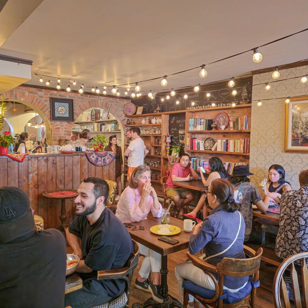 Cafe Aunja - a group of people sitting at tables - Cafes Near Me - Montreal, Quebec