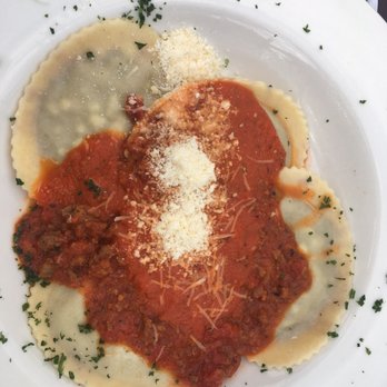 Frank's Restaurant - Braised beef ravioli with bolognese sauce. - Italian Near Me - Maine, New York Frank's Restaurant - Braised beef ravioli with bolognese sauce. - Italian Near Me - Maine, New York