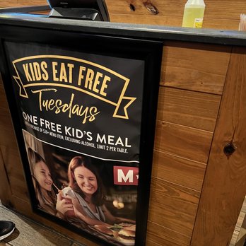 Miller's Ale House - a sign for kids eat free - American Near Me - Winter Park, Florida Miller's Ale House - a sign for kids eat free - American Near Me - Winter Park, Florida