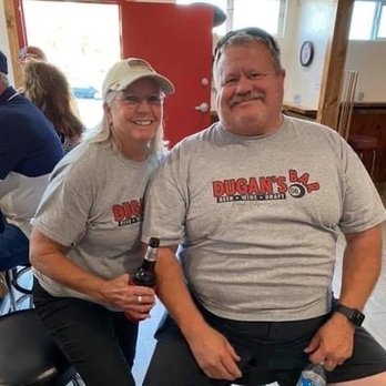 Dugans Beer & Wine - a man and woman sitting at a table - Sports Wear Near Me - Bakersfield, California Dugans Beer & Wine - a man and woman sitting at a table - Sports Wear Near Me - Bakersfield, California
