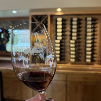 Thacher Winery - a hand holding a glass of wine - Wineries Near Me - Paso Robles, California Thacher Winery - a hand holding a glass of wine - Wineries Near Me - Paso Robles, California