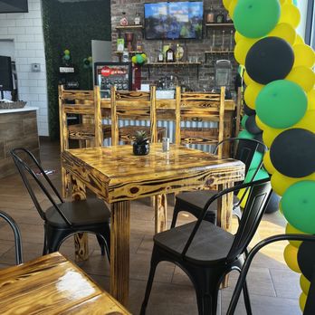 Jamaican Vibes Cuisine - a table and chairs - Caribbean Near Me - Baton Rouge, Louisiana