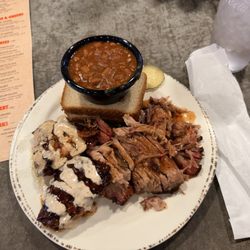 Saw's Soul Kitchen - Combo Plate. 3 Smoked Chicken Thighs. Pulled Pork Plate. Baked Beans. Holy shit it's good.