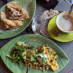 The Tribeca Cafe - Scrambled eggs with Mediterranean vegetables, Nutella banana crepe, and oatmilk cappuccino