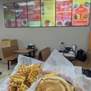 Big Mouth Grub - Black bean burger and waffles fries with menu in the background. - Burgers Near Me - La Porte, Texas Big Mouth Grub - Black bean burger and waffles fries with menu in the background. - Burgers Near Me - La Porte, Texas