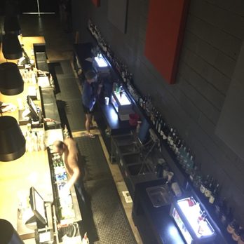The Signal - View of beautiful bar ( apologies for fuzzy photo) from middle of balcony steps. There is a Small Bar on balcony too. - Music Venues Near Me - Chattanooga, Tennessee