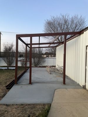 12x24 building extension - This client in Rendon TX wanted an extension on his existing building to have more storage. Initially he wanted the 12x24 extension and an awning above his door, so we talk with the client and came up with the building extension and patio cover all in one that would cover the door. Project length was estimated at 1 week and we were done in 4. 12x24 building extension - This client in Rendon TX wanted an extension on his existing building to have more storage. Initially he wanted the 12x24 extension and an awning above his door, so we talk with the client and came up with the building extension and patio cover all in one that would cover the door. Project length was estimated at 1 week and we were done in 4.