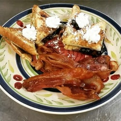 Egg Crackin Diner - Had the special of the day when I was there which was blueberry stuffed french toast with a side of bacon and it was delicious!!
