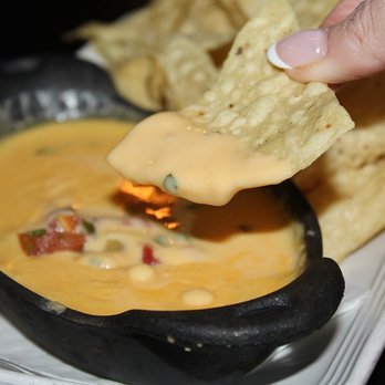 Rio Grande Mexican Restaurant - The Chile Con Queso was made with a cheese blend and pico de gallo. - Mexican Near Me - Lone Tree, Colorado Rio Grande Mexican Restaurant - The Chile Con Queso was made with a cheese blend and pico de gallo. - Mexican Near Me - Lone Tree, Colorado