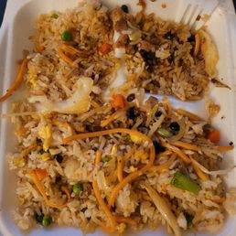Plate full of rice on the bottom of my 2 sides.. he just gave me a little bit of chow mein.. which was supposed to be half n half..