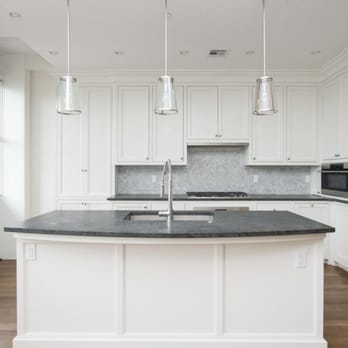 Cobblestone Management - a kitchen with a large island - General Contractors Near Me - Boston, Massachusetts Cobblestone Management - a kitchen with a large island - General Contractors Near Me - Boston, Massachusetts