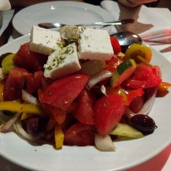 Zante - a white plate with a salad on it - Greek Near Me - Montreal, Quebec Zante - a white plate with a salad on it - Greek Near Me - Montreal, Quebec