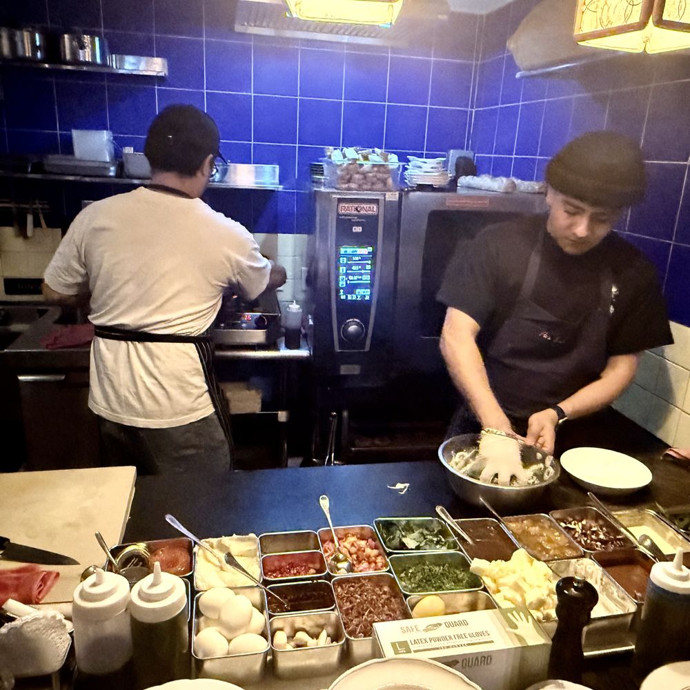 Ha's Snack Bar - Chefs at work in tiny open kitchen. - French Near Me - New York, New York Ha's Snack Bar - Chefs at work in tiny open kitchen. - French Near Me - New York, New York