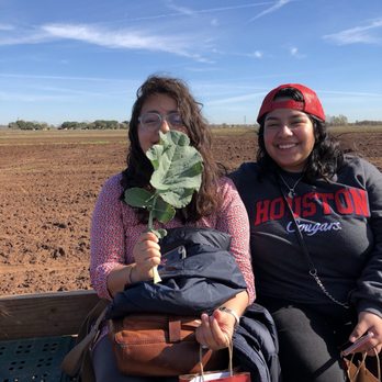 Loam Agronomics - two women sitting on a bench in a field - CSA Near Me - Richmond, Texas Loam Agronomics - two women sitting on a bench in a field - CSA Near Me - Richmond, Texas