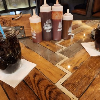 Bad Brads BBQ - Big drinks, quickly refilled. Beware the weird heavy wooden drinks menu on the left. - Barbeque Near Me - Livonia, Michigan